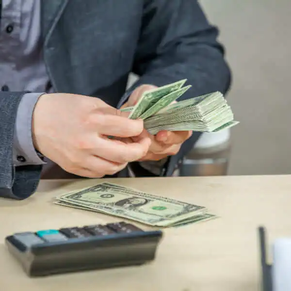 A professional financial advisor explaining loan options to a client in an office, focusing on choosing the best lender in Canada.